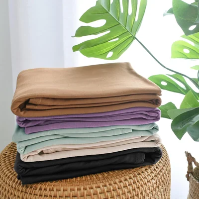 Two-Pack Newborn Swaddle and Hat Set by Owlowla, Olive and Black